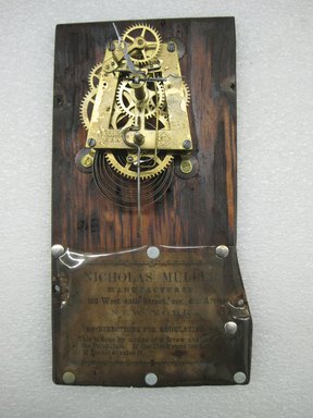 Nicholas Mueller Manufacturer (1855-1873). <em>"George Washington" Clock</em>, ca. 1865. Patinated base metal, wood, brass, glass, paper, height: 20 1/2 in. (52.1 cm). Brooklyn Museum, Museum Collection Fund, 2012.35. Creative Commons-BY (Photo: Brooklyn Museum, CUR.2012.35_back.jpg)