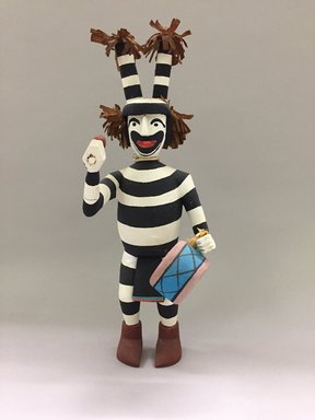 Hopi Pueblo. <em>Kachina Doll, Koshare Clown</em>, late 20th century. Wood (likely cottonwood), plant fibers, fabric, paint, cord, 15 × 5 1/4 × 7 in. (38.1 × 13.3 × 17.8 cm). Brooklyn Museum, Gift of Joan and Sanford Krotenberg, 2013.64.11. Creative Commons-BY (Photo: , CUR.2013.64.11_front.jpg)