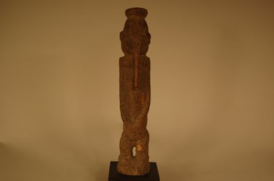 Dogon. <em>Figure</em>, early 20th century. Wood, organic materials, 10 x 1 15/16 x 1 13/16 in. (25.4 x 5 x 4.6 cm). Brooklyn Museum, Gift in memory of Frederic Zeller, 2014.54.21 (Photo: Brooklyn Museum, CUR.2014.54.21_front.jpg)