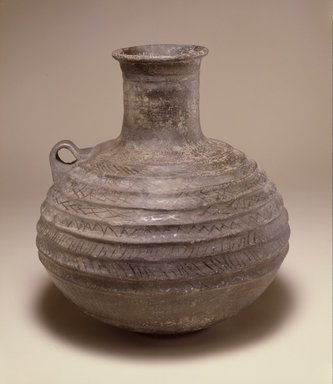  <em>Ribbed Jug</em>, 1st millennium B.C.E. Clay, slip, height: 10 5/8 in. (27 cm). Brooklyn Museum, Gift of the Arthur M. Sackler Foundation, NYC, in memory of James F. Romano, 2015.65.2. Creative Commons-BY (Photo: Photograph courtesy of the Arthur M. Sackler Foundation, New York, CUR.2015.65.2_Sackler_Foundation_image.jpg)