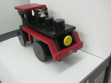 Frank Tilton (American, 1888-1957). <em>Engine, from Circus Train</em>, copyright 1953. Wood, pigment, metal, 10 1/2 x 7 5/8 x 22 1/8 in. (26.7 x 19.4 x 56.2 cm). Brooklyn Museum, Purchased with funds given in honor of Henry Christensen III, 2016.6.1. Creative Commons-BY (Photo: Brooklyn Museum, CUR.2016.6.1_threequarter.jpg)