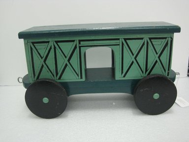 Frank Tilton (American, 1888-1957). <em>Freight Car, from Circus Train</em>, copyright 1953. Wood, pigment, metal, 10 1/2 x 7 5/8 x 22 1/8 in. (26.7 x 19.4 x 56.2 cm). Brooklyn Museum, Purchased with funds given in honor of Henry Christensen III, 2016.6.5. Creative Commons-BY (Photo: Brooklyn Museum, CUR.2016.6.5_side.jpg)