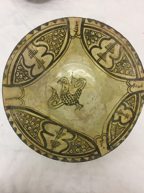  <em>Bowl with Bird Decoration in Center</em>, 10th century. Ceramic, earthenware, slip, glaze, height: 3 1/8 in. (8.0 cm). Brooklyn Museum, Gift of Thomas A.D. and Stephen E. Ettinghausen in memory of Richard and Elizabeth Ettinghausen, 2021.52.47 (Photo: Brooklyn Museum, CUR.2021.52.47.jpg)
