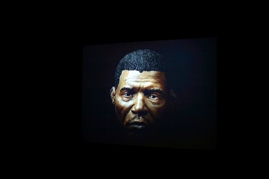 Thomas J Price (British, born 1981). <em>Man 9</em>, 2006. Single-channel video projection, color, silent, approx. 3 minutes Brooklyn Museum, Gift of Shelley Fox Aarons and Philip Aarons, 2022.3.4. © artist or artist's estate (Photo: Image courtesy of Hauser & Wirth., CUR.2022.3.4_Hauser_Wirth_high-res.jpg)