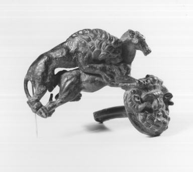 Roman. <em>Fragment for a Handle for Base</em>, 1st century C.E. Bronze, 2 13/16 × 3 3/4 × 2 3/16 in. (7.2 × 9.5 × 5.5 cm). Brooklyn Museum, Bequest of William H. Herriman, 21.479.10. Creative Commons-BY (Photo: Brooklyn Museum, CUR.21.479.10_print_negC_bw.jpg)