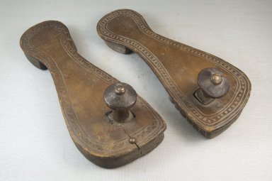 Swahili. <em>Pair of Clogs</em>, late 19th century. Wood, 3 x 3 3/4 x 10 in. (7.6 x 9.5 x 25.4 cm). Brooklyn Museum, Museum Expedition 1922, Robert B. Woodward Memorial Fund, 22.1047a-b. Creative Commons-BY (Photo: Brooklyn Museum, CUR.22.1047a-b_threequarter_PS5.jpg)