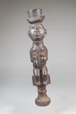 Vili. <em>Top of Whistle (Nsiba)</em>, late 19th or early 20th century. Wood, glass, lead, applied materials, 9 x 1 1/2 x 1 1/2 in. (22.9 x 3.8 x 3.8 cm). Brooklyn Museum, Museum Expedition 1922, Robert B. Woodward Memorial Fund, 22.104. Creative Commons-BY (Photo: Brooklyn Museum, CUR.22.104_front_PS5.jpg)