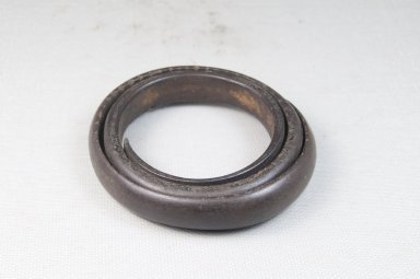  <em>Bracelet</em>. Carved wood, 2 15/16 x 3/8 in. (7.5 x 1 cm). Brooklyn Museum, Gift of Thomas A. Eddy, 22.1071. Creative Commons-BY (Photo: Brooklyn Museum, CUR.22.1071_front_PS5.jpg)