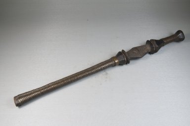  <em>Scepter</em>. Brass, 15 15/16 x 1 3/8 in. (40.5 x 3.5 cm). Brooklyn Museum, Museum Expedition 1922, Robert B. Woodward Memorial Fund, 22.1078. Creative Commons-BY (Photo: Brooklyn Museum, CUR.22.1078_threequarter_PS5.jpg)