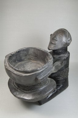 Luba. <em>Bowl with Female Figure</em>, late 19th or early 20th century. Wood, 13 x 10 3/4 x 14 in. (33 x 27.3 x 35.6 cm). Brooklyn Museum, Museum Expedition 1922, Robert B. Woodward Memorial Fund, 22.1135. Creative Commons-BY (Photo: Brooklyn Museum, CUR.22.1135_threequarter_PS5.jpg)