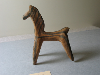 Cypriot. <em>Archaic Horse</em>. Terracotta, slip, 4 1/4 x 2 11/16 x 11/16 in. (10.8 x 6.8 x 1.8 cm). Brooklyn Museum, Gift of Mrs. Frederic H. Betts, 22.11. Creative Commons-BY (Photo: Brooklyn Museum, CUR.22.11_view01.jpg)