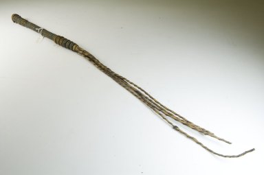  <em>Whip (Chicotte)</em>, before 1922. Rhinoceros hide, fiber, leather, 1 x 1 x 31 1/2 in. (2.5 x 2.5 x 80 cm). Brooklyn Museum, Museum Expedition 1922, Robert B. Woodward Memorial Fund, 22.1211. Creative Commons-BY (Photo: Brooklyn Museum, CUR.22.1211_threequarter_PS5.jpg)