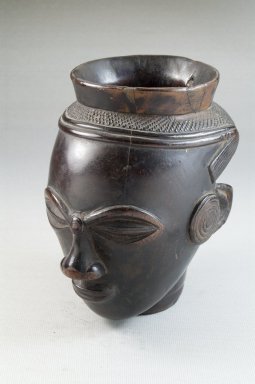 Kuba. <em>Palm Wine Cup in the Form of a Head (Mbwoongntey)</em>, early 20th century. Wood, 4 15/16 x 2 7/8 in. (12.5 x 7.3 cm). Brooklyn Museum, Museum Expedition 1922, Robert B. Woodward Memorial Fund, 22.125. Creative Commons-BY (Photo: Brooklyn Museum, CUR.22.125_threequarter_PS5.jpg)