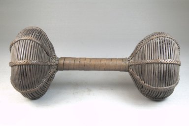 Chokwe. <em>Double Basket Rattle (Musambo)</em>, late 19th or early 20th century. Brass, seed pots, rattan, 9 1/16 x 3 1/8 in. (23 x 7.9 cm). Brooklyn Museum, Museum Expedition 1922, Robert B. Woodward Memorial Fund, 22.1307. Creative Commons-BY (Photo: Brooklyn Museum, CUR.22.1307_front_PS5.jpg)