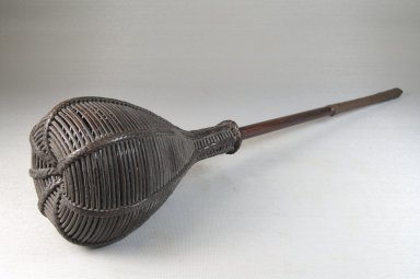 Chokwe. <em>Basket Rattle (Musambo)</em>, late 19th or early 20th century. Wood, metal, rattan, 17 1/4 x 3 1/2 in. (43.8 x 8.9 cm). Brooklyn Museum, Museum Expedition 1922, Robert B. Woodward Memorial Fund, 22.1318. Creative Commons-BY (Photo: Brooklyn Museum, CUR.22.1318_threequarter_PS5.jpg)