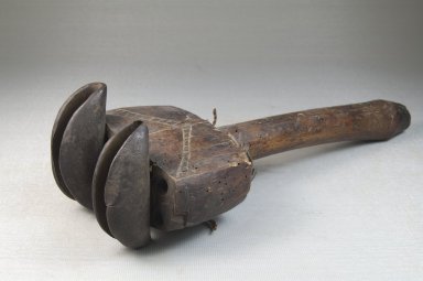  <em>Rattle</em>, late 19th or early 20th century. Wood, iron, fiber, 9 7/16 x 3 7/16 in. (24 x 8.7 cm). Brooklyn Museum, Museum Expedition 1922, Robert B. Woodward Memorial Fund, 22.1320. Creative Commons-BY (Photo: Brooklyn Museum, CUR.22.1320_threequarter_PS5.jpg)