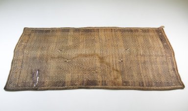 Kongo. <em>Mat</em>, late 19th century. Rattan, 13 3/8 x 24 13/16 in. (34 x 63 cm). Brooklyn Museum, Museum Expedition 1922, Robert B. Woodward Memorial Fund, 22.1325. Creative Commons-BY (Photo: Brooklyn Museum, CUR.22.1325_front_PS5.jpg)