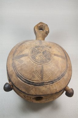 Yombe. <em>Bell (Dibu)</em>, late 19th–early 20th century. Wood, pigment, skin thong, applied material, 13 1/2 x 9 1/4 x 6 1/4 in. (34.3 x 23.5 x 15.9 cm). Brooklyn Museum, Museum Expedition 1922, Robert B. Woodward Memorial Fund, 22.1327. Creative Commons-BY (Photo: Brooklyn Museum, CUR.22.1327_front_PS5.jpg)