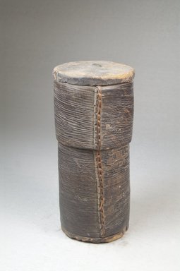 Kuba ?. <em>Cylindrical Box with Cover</em>. Bark, wood, fiber, pigment, upholstery stud, 5 1/8 x 2 3/8 in. (13 x 6 cm). Brooklyn Museum, Museum Expedition 1922, Robert B. Woodward Memorial Fund, 22.132a-b. Creative Commons-BY (Photo: Brooklyn Museum, CUR.22.132a-b_front_PS5.jpg)