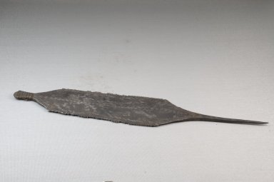  <em>Toothed Implement</em>, before 1922. Iron, 2 3/8 x 12 13/16 in. (6 x 32.5 cm). Brooklyn Museum, Museum Expedition 1922, Robert B. Woodward Memorial Fund, 22.1400. Creative Commons-BY (Photo: Brooklyn Museum, CUR.22.1400_threequarter_PS5.jpg)