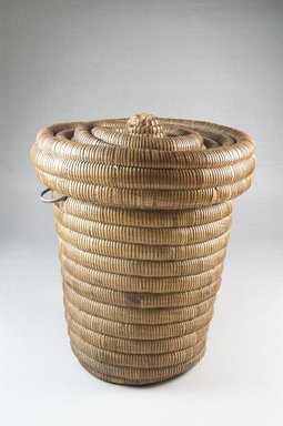 Luba ?. <em>Coiled Covered Basket</em>, late 19th-early 20th century. Vegetal fiber, metal, height: 7 5/8 in. Brooklyn Museum, Museum Expedition 1922, Robert B. Woodward Memorial Fund, 22.1402a-b. Creative Commons-BY (Photo: Brooklyn Museum, CUR.22.1402a-b_assembled_PS5.jpg)
