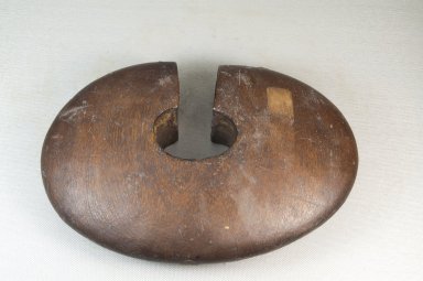 Tutsi. <em>Wrist Guard (Igitembe)</em>, first half of 20th century. Wood, copper alloy, 6 x 9 x 2 1/8 in. (15.2 x 22.9 x 5.4 cm). Brooklyn Museum, Museum Expedition 1922, Robert B. Woodward Memorial Fund, 22.1403. Creative Commons-BY (Photo: Brooklyn Museum, CUR.22.1403_front_PS5.jpg)