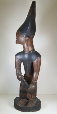 Possibly Kongo. <em>Figure of Man with Knife</em>, 19th or 20th century. Wood, pigment, ceramic, 38 x 10 3/4 in. (96.5 x 27.3 cm). Brooklyn Museum, Museum Expedition 1922, Robert B. Woodward Memorial Fund, 22.1410. Creative Commons-BY (Photo: Brooklyn Museum, CUR.22.1410_front_ps5.jpg)