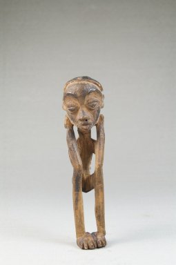 Lulua. <em>Figure of a Squatting Male</em>, early 20th century. Wood, 4 1/2 x 1 1/4 x 1 1/4 in. (11.4 x 3.2 x 3.2 cm). Brooklyn Museum, Museum Expedition 1922, Robert B. Woodward Memorial Fund, 22.1448. Creative Commons-BY (Photo: Brooklyn Museum, CUR.22.1448_front_PS5.jpg)