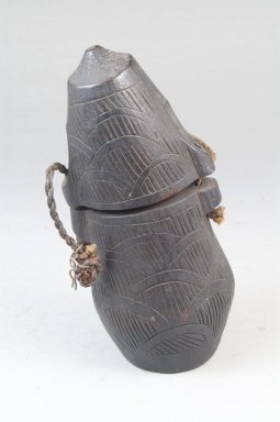 Kongo. <em>Powder Box (Tutukipfula)</em>, late 19th–early 20th century. Wood, cord, height: 5 1/4 in. (13.3 cm); diameter: 2 1/2 in. (6.4 cm). Brooklyn Museum, Museum Expedition 1922, Robert B. Woodward Memorial Fund, 22.144. Creative Commons-BY (Photo: Brooklyn Museum, CUR.22.144_front_PS5.jpg)