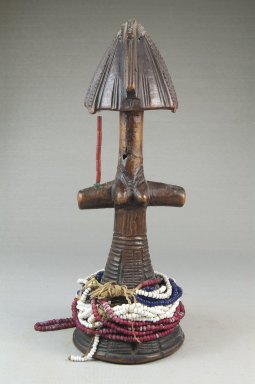 Bagirmi. <em>Female Doll</em>, 19th century. Wood, plastic beads, cotton string, 10 1/2 x 3 3/4 x 3/4 in. (26.7 x 9.5 x 1.9 cm). Brooklyn Museum, Museum Expedition 1922, Robert B. Woodward Memorial Fund, 22.1456. Creative Commons-BY (Photo: Brooklyn Museum, CUR.22.1456_front_PS5.jpg)