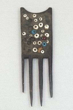 Possibly Luba. <em>Comb</em>. Wood, beads, 4 5/16 x 1 3/8 in. (11 x 3.5 cm). Brooklyn Museum, Museum Expedition 1922, Robert B. Woodward Memorial Fund, 22.1473. Creative Commons-BY (Photo: Brooklyn Museum, CUR.22.1473_front_PS5.jpg)