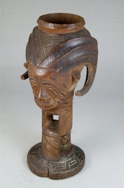 Kuba (Bushoong subgroup). <em>Single Head Goblet (Mbwoongntey)</em>, early 20th century. Wood, 8 1/16 x 3 1/2 in. (20.5 x 8.9 cm). Brooklyn Museum, Museum Expedition 1922, Robert B. Woodward Memorial Fund, 22.1485. Creative Commons-BY (Photo: Brooklyn Museum, CUR.22.1485_threequarter_PS5.jpg)