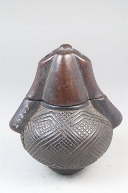 Kunyi Kongo. <em>Powder Box (Tutukipfula)</em>, late 19th or early 20th century. Wood, copper alloy, 4 1/2 x 3 3/4 in. (11.4 x 9.5 cm). Brooklyn Museum, Museum Expedition 1922, Robert B. Woodward Memorial Fund, 22.148a-b. Creative Commons-BY (Photo: Brooklyn Museum, CUR.22.148_front_PS5.jpg)