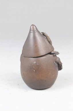 Kongo. <em>Powder Box (Tutukipfula)</em>, late 19th-early 20th century. Wood, fiber, height: 2 3/4 in. (7 cm); diameter: 1 3/4 in. (4.4 cm). Brooklyn Museum, Museum Expedition 1922, Robert B. Woodward Memorial Fund, 22.149a-b. Creative Commons-BY (Photo: Brooklyn Museum, CUR.22.149_front_PS5.jpg)