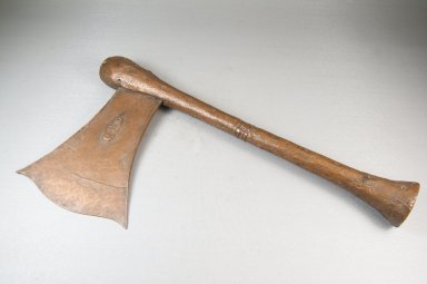 Songye. <em>Axe</em>, late 19th-early 20th century. Copper alloy, wood, 7 7/8 x 15 3/8 in. (20 x 39 cm). Brooklyn Museum, Museum Expedition 1922, Robert B. Woodward Memorial Fund, 22.1516. Creative Commons-BY (Photo: Brooklyn Museum, CUR.22.1516_threequarter_PS5.jpg)