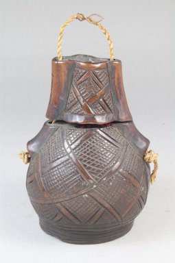 Kunyi Kongo. <em>Powder Box (Tutukipfula)</em>, late 19th-early 20th century. Wood, fiber, copper alloy, height: 4 3/4 in. (12.1 cm); diameter: 3 1/2 in. (8.9 cm). Brooklyn Museum, Museum Expedition 1922, Robert B. Woodward Memorial Fund, 22.151a-b. Creative Commons-BY (Photo: Brooklyn Museum, CUR.22.151a-b_front_PS5.jpg)