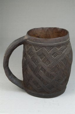 Kuba. <em>Cup</em>, early 20th century. Wood, 7 1/2 x 3 9/16 in. (19.1 x 9 cm). Brooklyn Museum, Museum Expedition 1922, Robert B. Woodward Memorial Fund, 22.154. Creative Commons-BY (Photo: Brooklyn Museum, CUR.22.154_front_PS5.jpg)