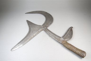 Ngbandi. <em>Throwing Knife</em>, 19th century. Iron, wood, metal strips, 12 5/8 x 16 15/16 in. (32 x 43 cm). Brooklyn Museum, Museum Expedition 1922, Robert B. Woodward Memorial Fund, 22.1565. Creative Commons-BY (Photo: Brooklyn Museum, CUR.22.1565_top_PS5.jpg)