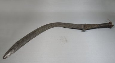 Ngbandi. <em>Executioner's Sword</em>, late 19th century. Iron, wood, vegetal fiber, metal wire, 2 3/8 x 27 3/16 in. (6 x 69 cm). Brooklyn Museum, Museum Expedition 1922, Robert B. Woodward Memorial Fund, 22.1574. Creative Commons-BY (Photo: Brooklyn Museum, CUR.22.1574_side_PS5.jpg)