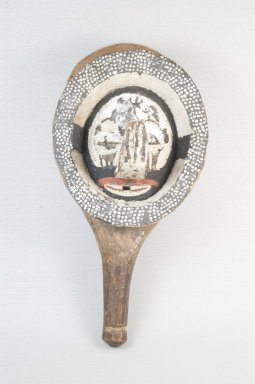 Yaka. <em>Hand-held Mask for Nkanda Initiation</em>, late 19th or early 20th century. Wood, pigment, cloth, vegetable cordage, 10 1/2 x 5 1/4 x 3 1/2 in. (27.0 x 13.0 x 9.0 cm). Brooklyn Museum, Museum Expedition 1922, Robert B. Woodward Memorial Fund, 22.1583. Creative Commons-BY (Photo: Brooklyn Museum, CUR.22.1583_front_PS5.jpg)