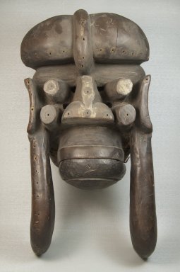 We. <em>Mask</em>, 19th century. Wood, vegetable material, pigment, vegetable twine, ferrous nails, 17 x 8 3/4 x 6 3/4 in. (43.2 x 22.2 x 17.1 cm). Brooklyn Museum, Museum Expedition 1922, Robert B. Woodward Memorial Fund, 22.1591. Creative Commons-BY (Photo: Brooklyn Museum, CUR.22.1591_front_PS5.jpg)