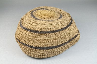 Kongo. <em>Basketry Cap</em>, late 19th-early 20th century. Raffia fiber, brown bands, Height: 3 1/8in. (7.9cm.). Brooklyn Museum, Museum Expedition 1922, Robert B. Woodward Memorial Fund, 22.1619. Creative Commons-BY (Photo: Brooklyn Museum, CUR.22.1619_front_PS5.jpg)