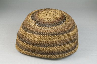 Yombe. <em>Basketry Cap (Mpu)</em>, late 19th-early 20th century. Raffia, height: 3 1/8 in. (8 cm); diameter: 5 7/8 in. (14.9 cm). Brooklyn Museum, Museum Expedition 1922, Robert B. Woodward Memorial Fund, 22.1627. Creative Commons-BY (Photo: Brooklyn Museum, CUR.22.1627_front_PS5.jpg)