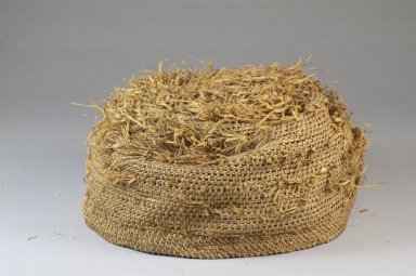 Possibly Kongo. <em>Basketry Cap</em>, late 19th century. Fiber, raffia, height: 3 1/8 in. (7.9 cm); diameter: 6 5/16 in. (16 cm). Brooklyn Museum, Museum Expedition 1922, Robert B. Woodward Memorial Fund, 22.1644. Creative Commons-BY (Photo: Brooklyn Museum, CUR.22.1644_front_PS5.jpg)