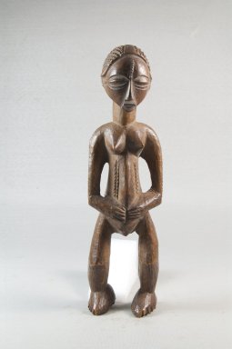 Luba. <em>Standing Female Figure</em>, late 19th or early 20th century. Wood, 9 x 2 1/4 x 2 3/4 in. (22.9 x 5.7 x 7 cm). Brooklyn Museum, Museum Expedition 1922, Robert B. Woodward Memorial Fund, 22.166. Creative Commons-BY (Photo: Brooklyn Museum, CUR.22.166_front_PS5.jpg)