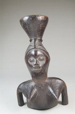 Mbala. <em>Figural Mortar</em>. Wood, 8 1/4 x 4 3/4 x 4 1/2 in. (20.8 x 11.7 x 11.5 cm). Brooklyn Museum, Museum Expedition 1922, Robert B. Woodward Memorial Fund, 22.174. Creative Commons-BY (Photo: Brooklyn Museum, CUR.22.174_front_PS5.jpg)