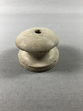  <em>Handle</em>, ca. 1352-1332 B.C.E. Limestone, 2 1/16 × Diam. 2 3/4 in. (5.2 × 7 cm). Brooklyn Museum, Gift of the Egypt Exploration Society, 22.1915. Creative Commons-BY (Photo: , CUR.22.1915_view05.jpg)