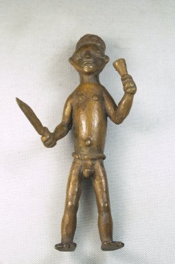 Bwayen (We, flourished 1920s–1930s). <em>Male Nude Holding Knife and Horn</em>, early 20th century. Copper alloy, 7 1/4 x 3 3/4 x 3in. (18.4 x 9.5 x 7.6cm). Brooklyn Museum, Museum Expedition 1922, Robert B. Woodward Memorial Fund, 22.212. Creative Commons-BY (Photo: Brooklyn Museum, CUR.22.212_front_PS5.jpg)