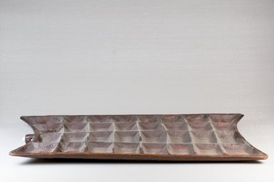  <em>Mancala Game Board</em>, late 19th century. Wood, 1/2 x 19 x 10 in. (1.3 x 48.3 x 25.4 cm). Brooklyn Museum, Museum Expedition 1922, Robert B. Woodward Memorial Fund, 22.217. Creative Commons-BY (Photo: Brooklyn Museum, CUR.22.217_front_PS5.jpg)