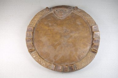 Yorùbá. <em>Divination Board (Pako Ifa)</em>, late 19th century. Wood, 3/4 x 9 5/8 x 9 5/8 in. (1.9 x 24.4 x 24.4 cm). Brooklyn Museum, Museum Expedition 1922, Robert B. Woodward Memorial Fund
, 22.237. Creative Commons-BY (Photo: Brooklyn Museum, CUR.22.237_top_PS5.jpg)